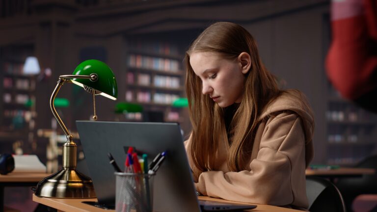 Female student makes final preparations for her university periodicals